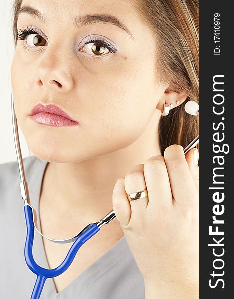 Young woman doctor or nurse holding a stethoscope