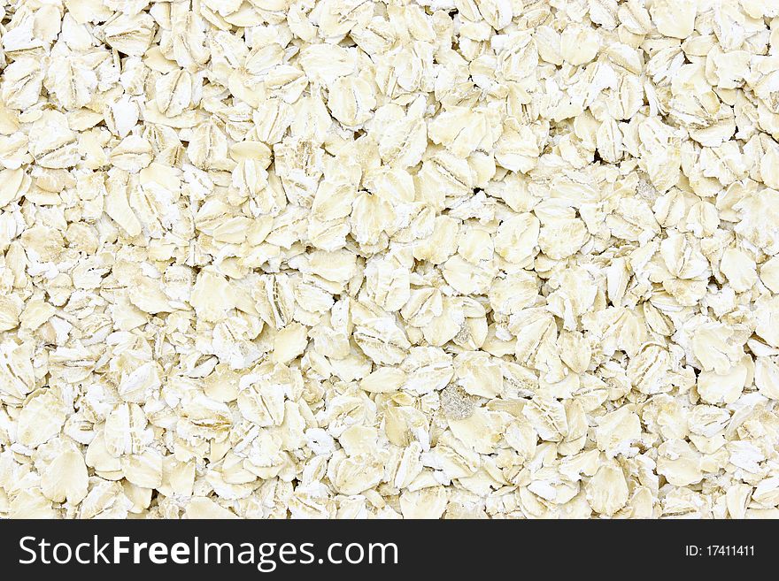 Groats of oat-flakes as a background