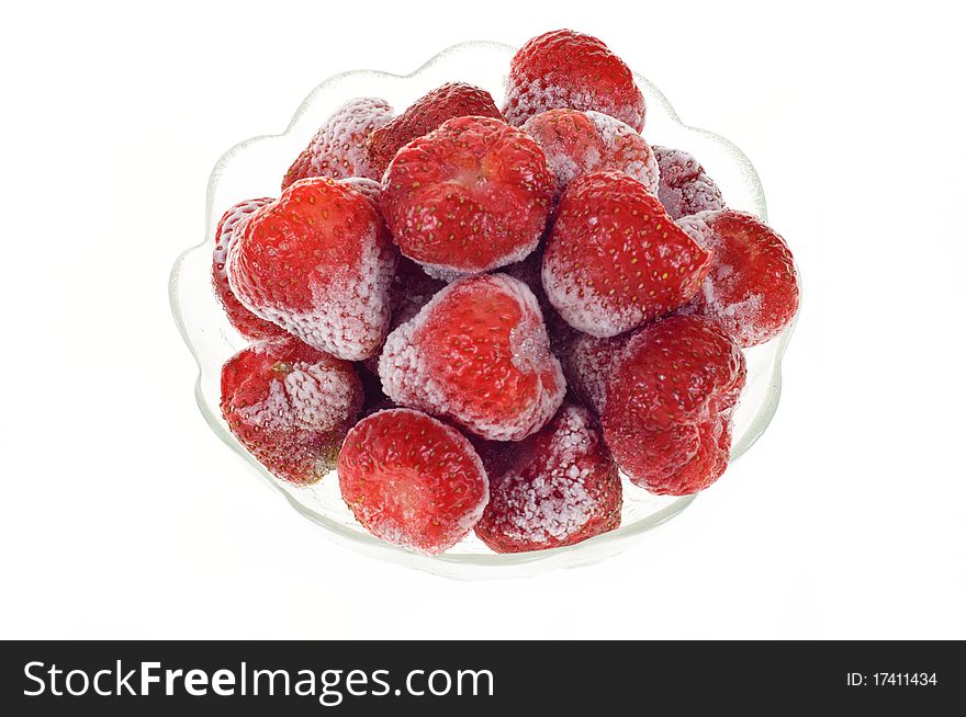 Strawberry sliced in a glass holder, isolated on white background