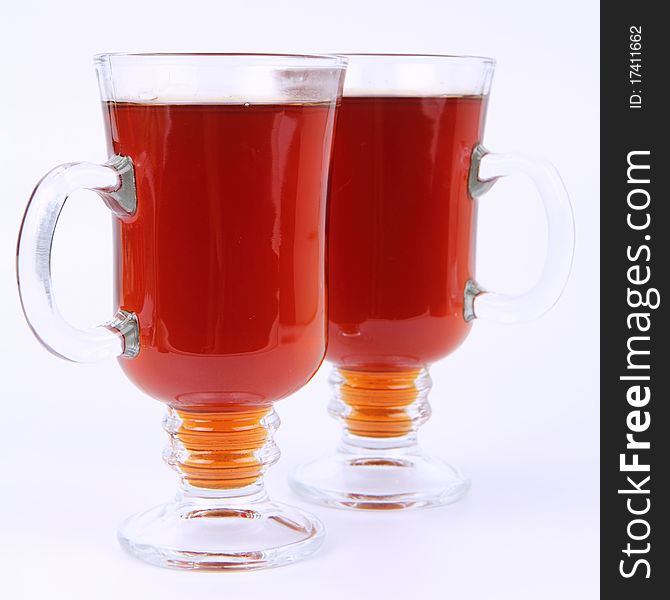 Two glasses of tea on white background