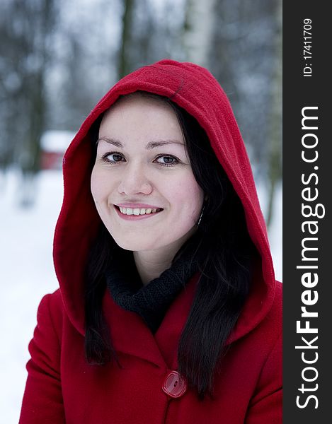 Smiling young pretty girl in the red coat. Smiling young pretty girl in the red coat