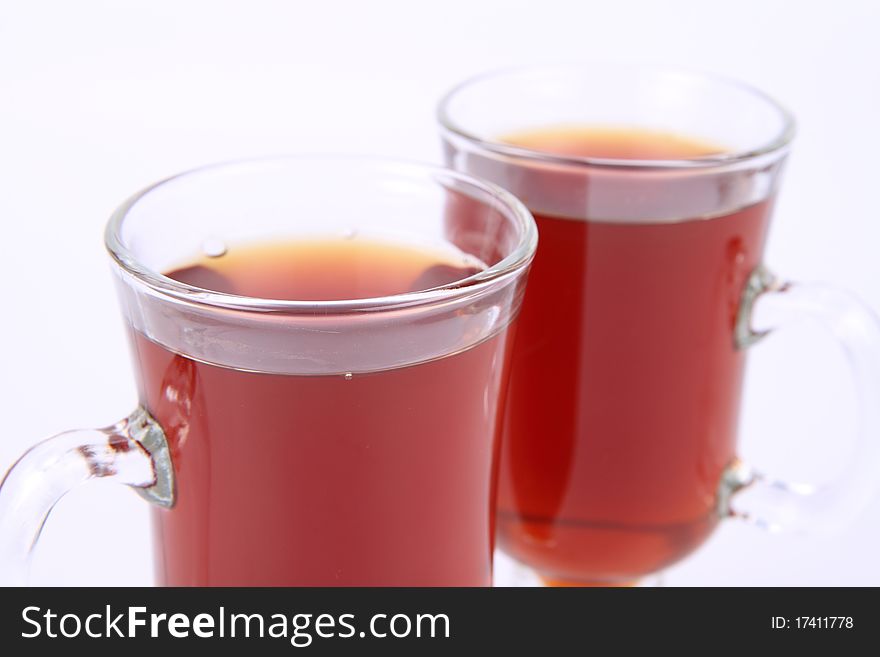 Two glasses of tea on white background