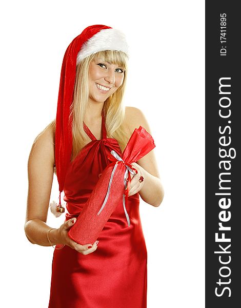 Beautiful girl in a red dress and a Christmas hat holding a boxed bottle of wine. Lots of copyspace and room for text on this isolate. Beautiful girl in a red dress and a Christmas hat holding a boxed bottle of wine. Lots of copyspace and room for text on this isolate