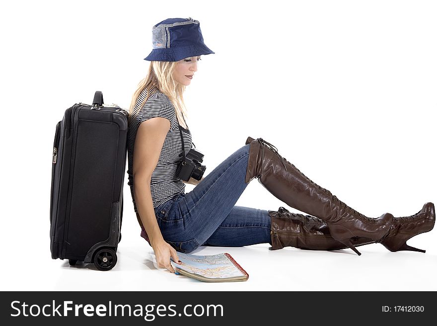 Tourist woman with her suitcase and world map ready to go on a trip. Tourist woman with her suitcase and world map ready to go on a trip