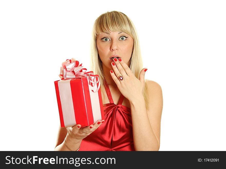 Beautiful girl in a red dress and hat of Santa with a big gift box. Surprised. Lots of copyspace and room for text on this isolate. Beautiful girl in a red dress and hat of Santa with a big gift box. Surprised. Lots of copyspace and room for text on this isolate