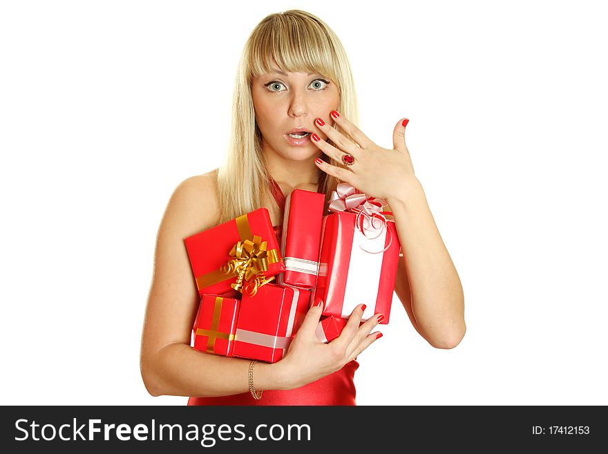 Beautiful girl in a red dress with lots of red gift boxes for Christmas. Surprised. Lots of copyspace and room for text on this isolate. Beautiful girl in a red dress with lots of red gift boxes for Christmas. Surprised. Lots of copyspace and room for text on this isolate