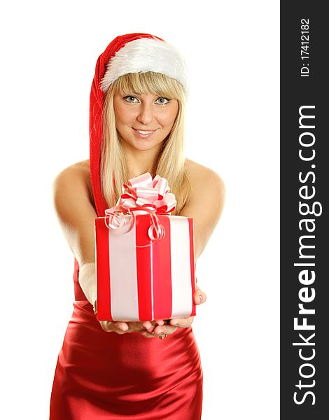 Beautiful girl in a red dress and hat of Santa with a big gift box. Lots of copyspace and room for text on this isolate. Beautiful girl in a red dress and hat of Santa with a big gift box. Lots of copyspace and room for text on this isolate