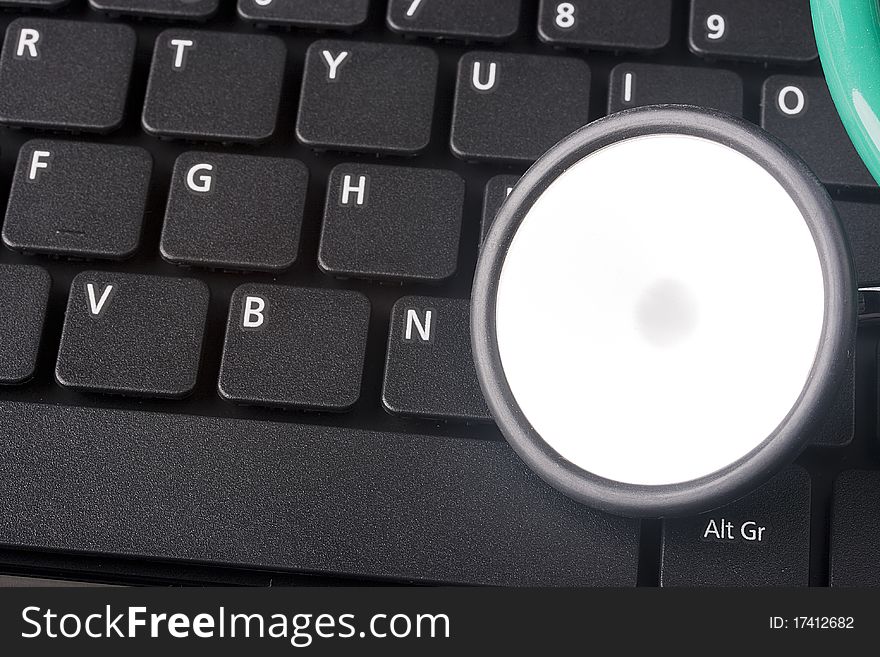 Keyboard laptop computer with a medical stethoscope. Keyboard laptop computer with a medical stethoscope.