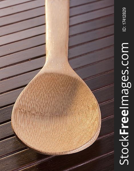 Wooden spoon - used as a tool for cooking.