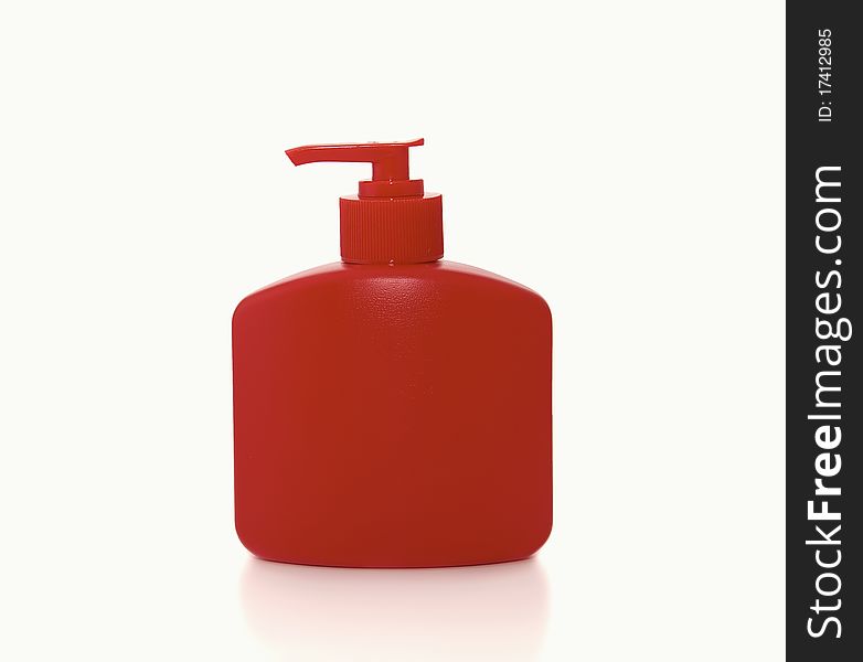 Red bottle of liquid soap on a white background