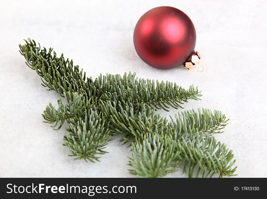 A fir tree branch with Christmas bauble. A fir tree branch with Christmas bauble