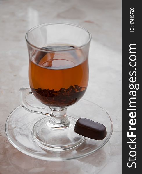 Cup of black tea with sweet candy. Cup of black tea with sweet candy