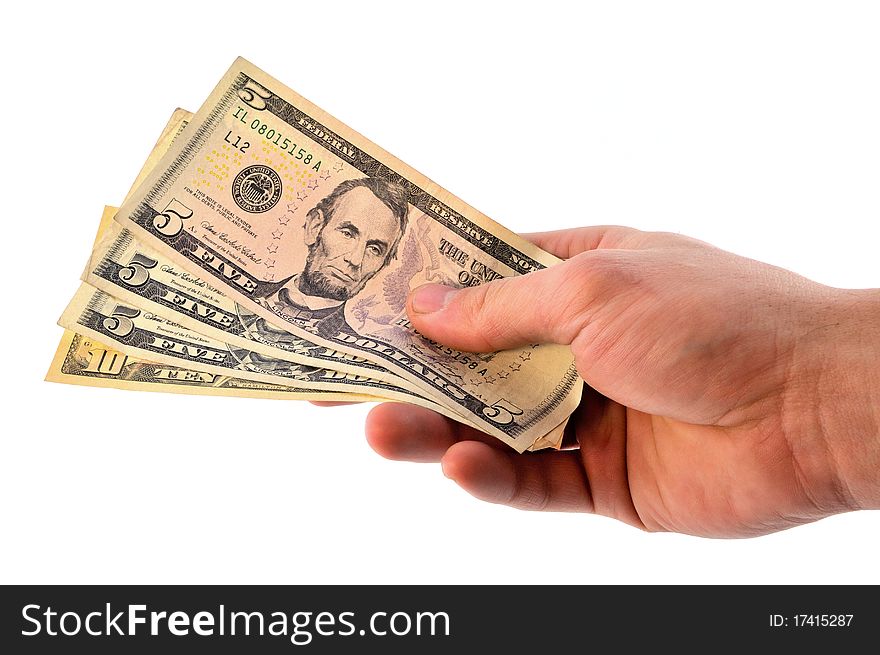 The man stretches out to someone dollar bills clenched in his hand. The man stretches out to someone dollar bills clenched in his hand
