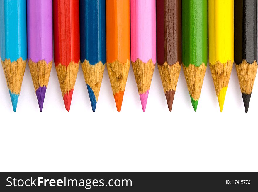 Pencils in a row on a white background.