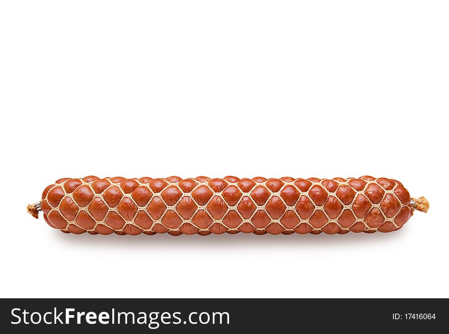 The sausage long loaf is tied up by a grid from a cord. On a white background