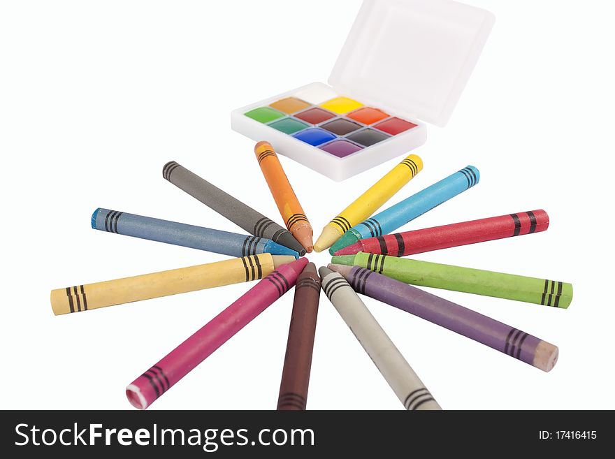 Colored wax pencils and a watercolor isolated on a on white background with clipping path