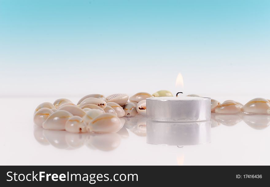 Peaceful Setting with Candle and Shells