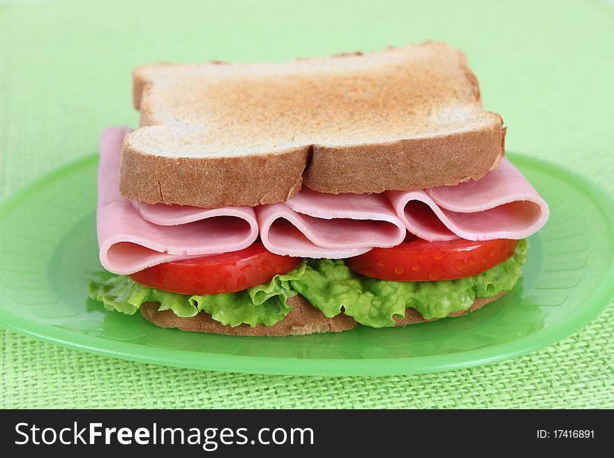 ham sandwich with tomato and lettuce