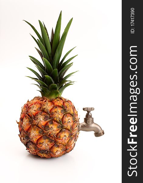 Ripe pineapple with a tap