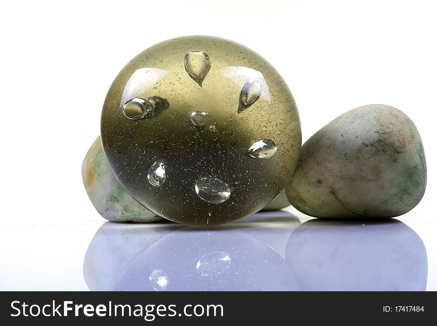 Glass paper weight with wwhite background.