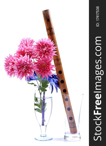 Concept pic of flowers and flute isolated on white background. Concept pic of flowers and flute isolated on white background.