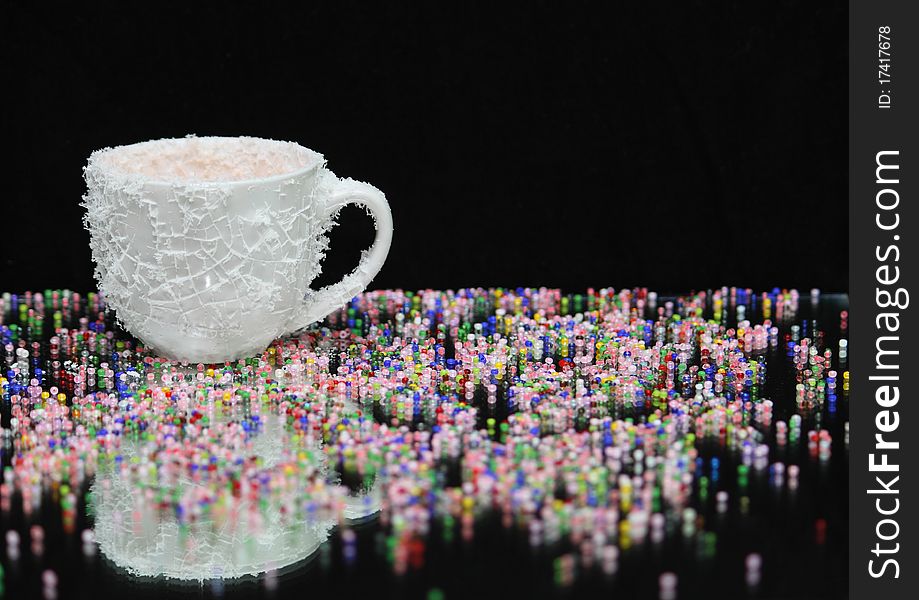 White coffee cup, covered with cold hoarfrost.