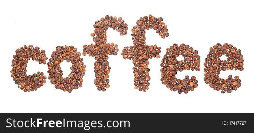 Word coffee is laid out from the corns of coffee isolated on white