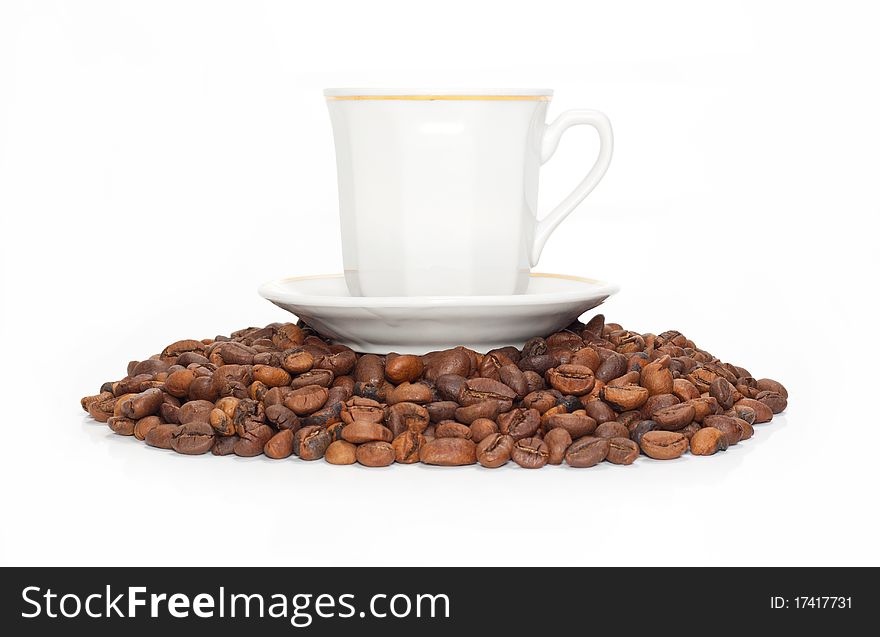 Cup on the corns of coffees isolated on a white background