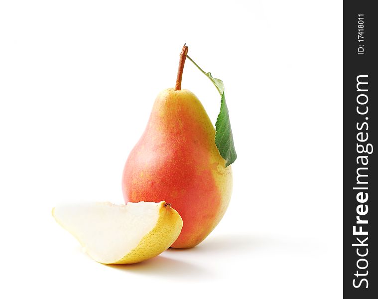Ripe pears, whole and cut isolated on white background