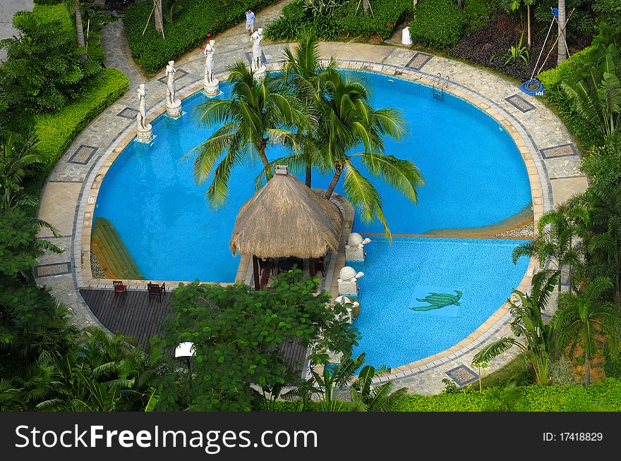 Luxurious covered patio with pool, and tropical flowers and trees. Luxurious covered patio with pool, and tropical flowers and trees