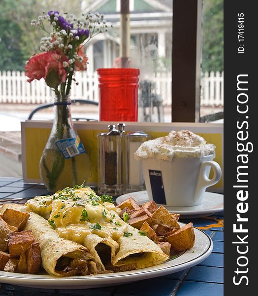 Steak crepes with scrambled eggs and hearty potatoes