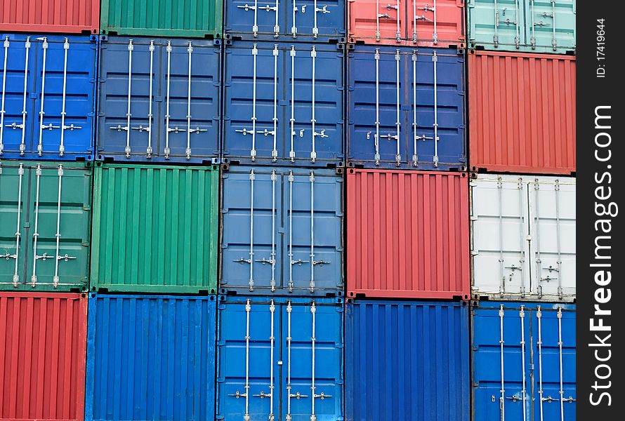 Background of multi-colored freight shipping containers at the docks. Background of multi-colored freight shipping containers at the docks