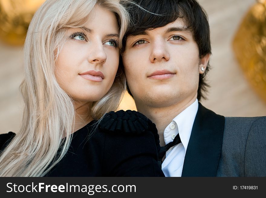 Couple - girl and guy near the wall