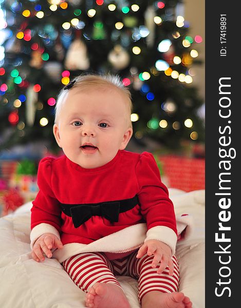 Happy Baby Girl in santa outfit for christmas. Happy Baby Girl in santa outfit for christmas