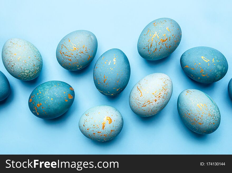 Easter Background Of Eggs Painted In Blue Color.