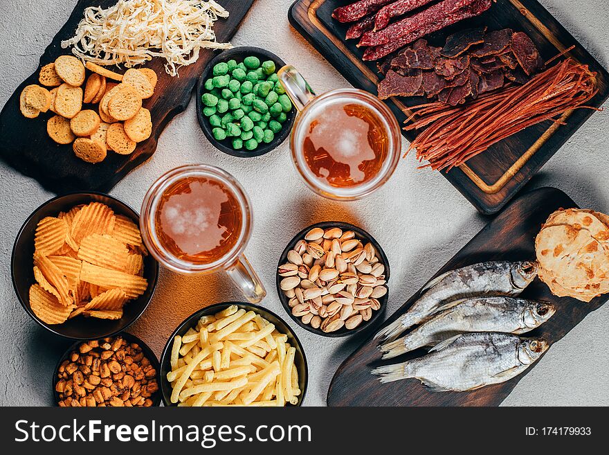 Set of appetizers and salty beer snacks. Pile of food for big company. Party, sport bar, pub, restaurant menu. Set of appetizers and salty beer snacks. Pile of food for big company. Party, sport bar, pub, restaurant menu