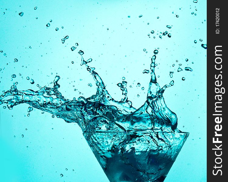 Drink splashes on blue background. Drink splashes on blue background