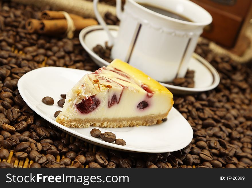 Delicious piece of cake and coffee in old fashioned background