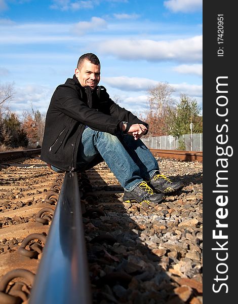 Tourist waiting for his train at the train station, This guy is ready for a great trip. Tourist waiting for his train at the train station, This guy is ready for a great trip.