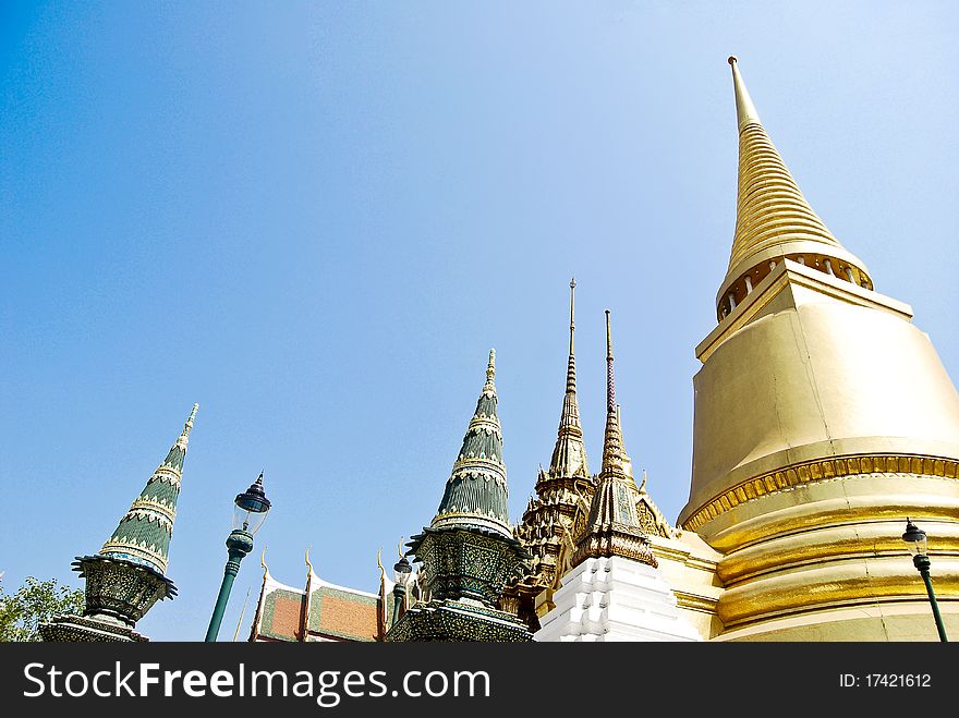 Golden Buddha Temple in Grand palace on blue sky background in Thailand. Golden Buddha Temple in Grand palace on blue sky background in Thailand