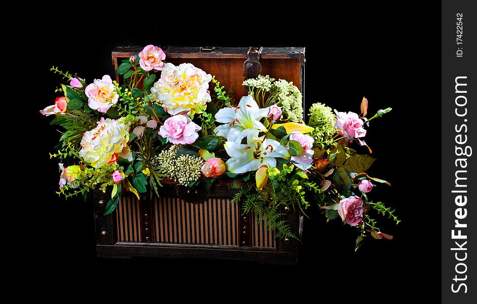 Flowers in a box isolated over a black background