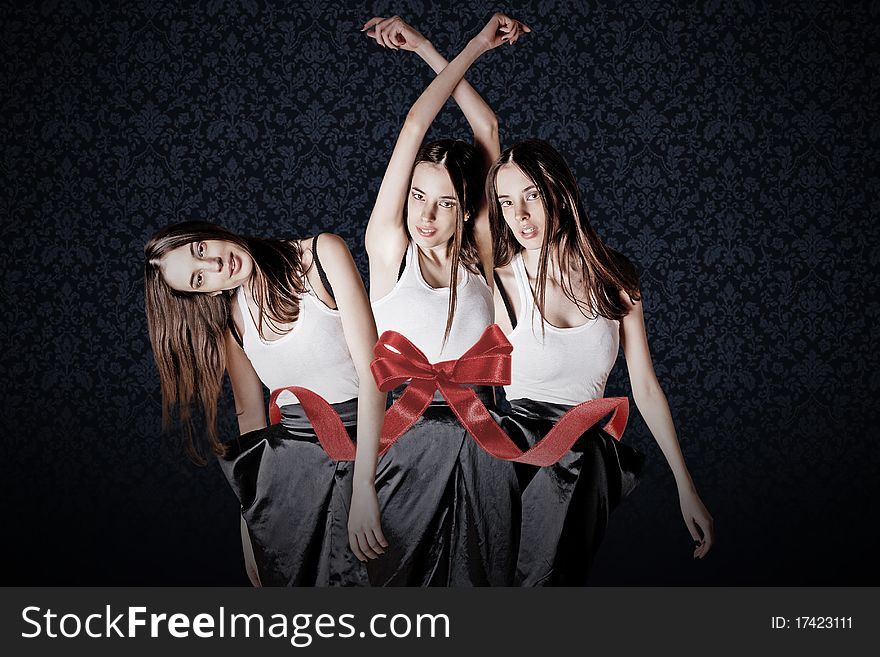 Beauty young womans in gift ribbon