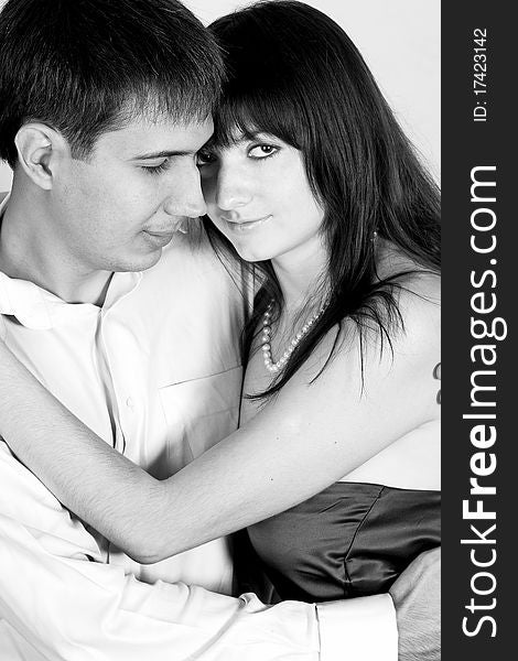 Desaturated portrait of love couple in studio