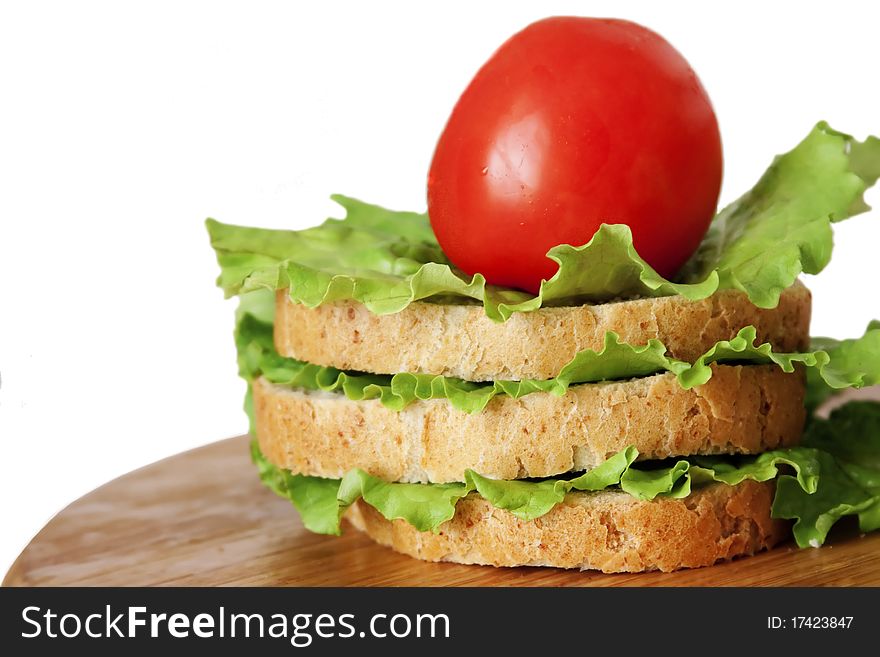 Sandwich of bread with lettuce and tomato isolated