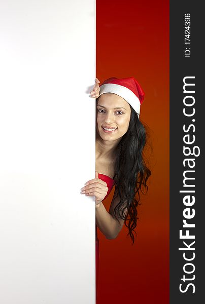 Christmas woman holding a white sign. Christmas woman holding a white sign