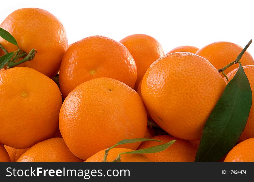 Tangerines And Green Leaves Isolated On White