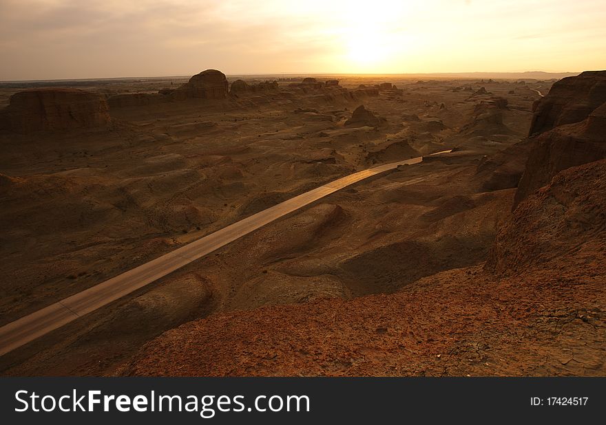 A road in mountain,at sunset.Xingjiang province,China.