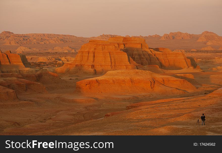 A photographer were waiting for sunset.Xinjiang province,China.