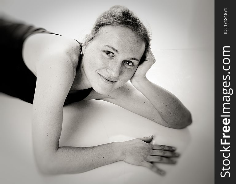 Young happy woman in sport wear. Black and white