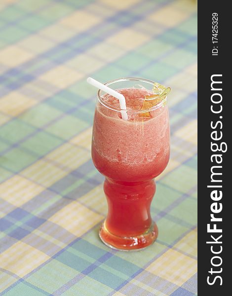 Red and fresh watermelon smoothie with white straw